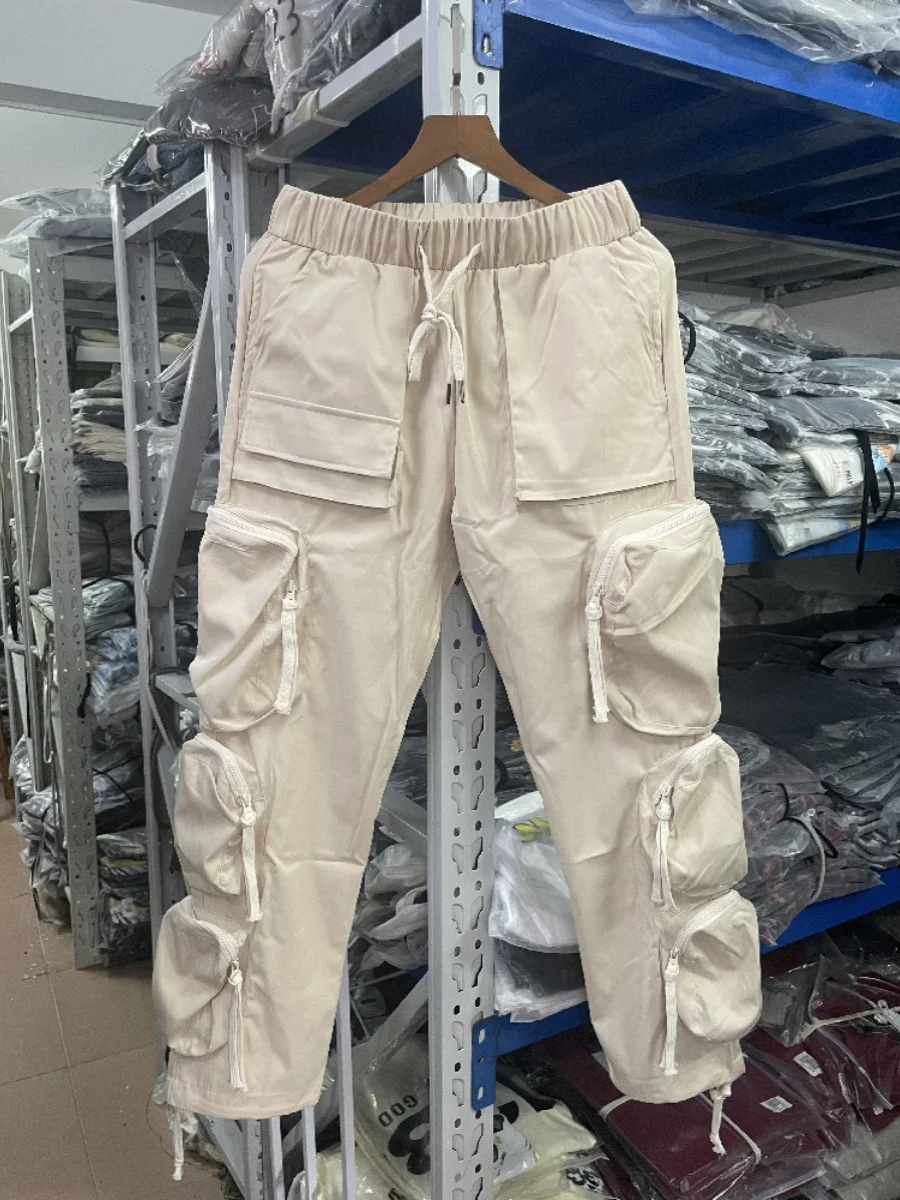 Tendencia de pantalones casuales de tobillo sueltos para hombres estilo American High Street con múltiples bolsillos