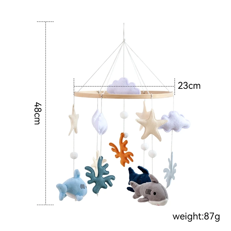 ตาปลาฉลามกลมของเด็กมอนเตสซอรี่มีเสน่ห์น่ารัก และจี้ปลาและปลาดาวขนาดเล็กที่แขวนมีสีสันสดใส