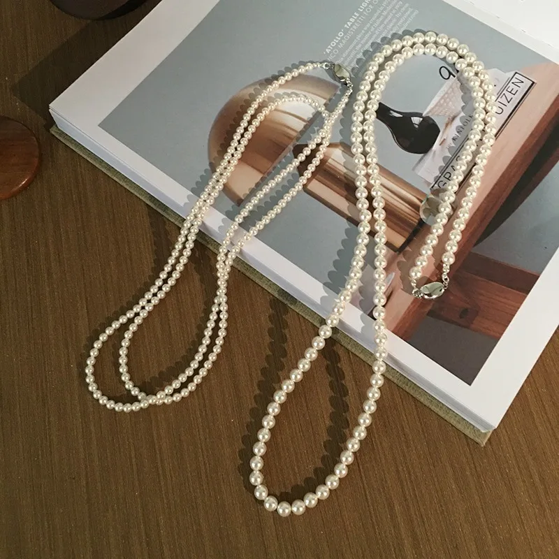 wearing methods, long pearl necklace is round and strong light Shijia pearl sweater chain light luxury high-end stacking style