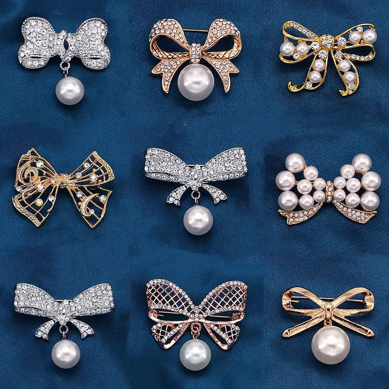 Fashion bow anti-light alloy high-grade Korean version diamond-encrusted pearl brooch rhinestone clothing pin brooch wholesale