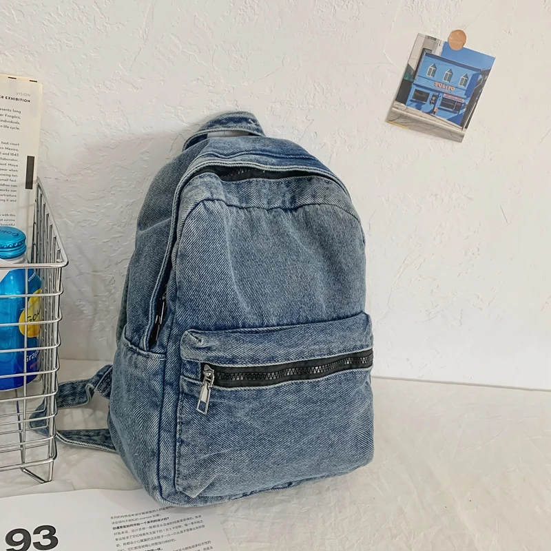 A classic popular solid color denim backpack, comfortable fabric, large capacity, suitable for business travel commuting shoppin