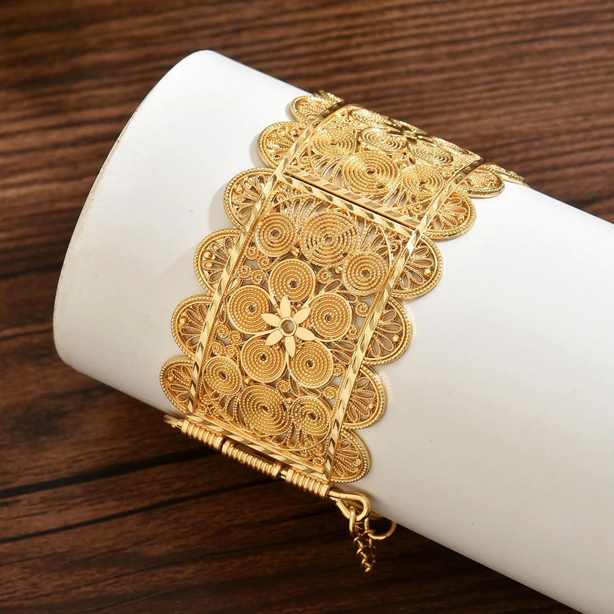 

Moroccan Bride's Golden Bracelet With Hollowed-Out Pattern And Open Design. Handcrafted Bracelet In Algerian Traditional Style