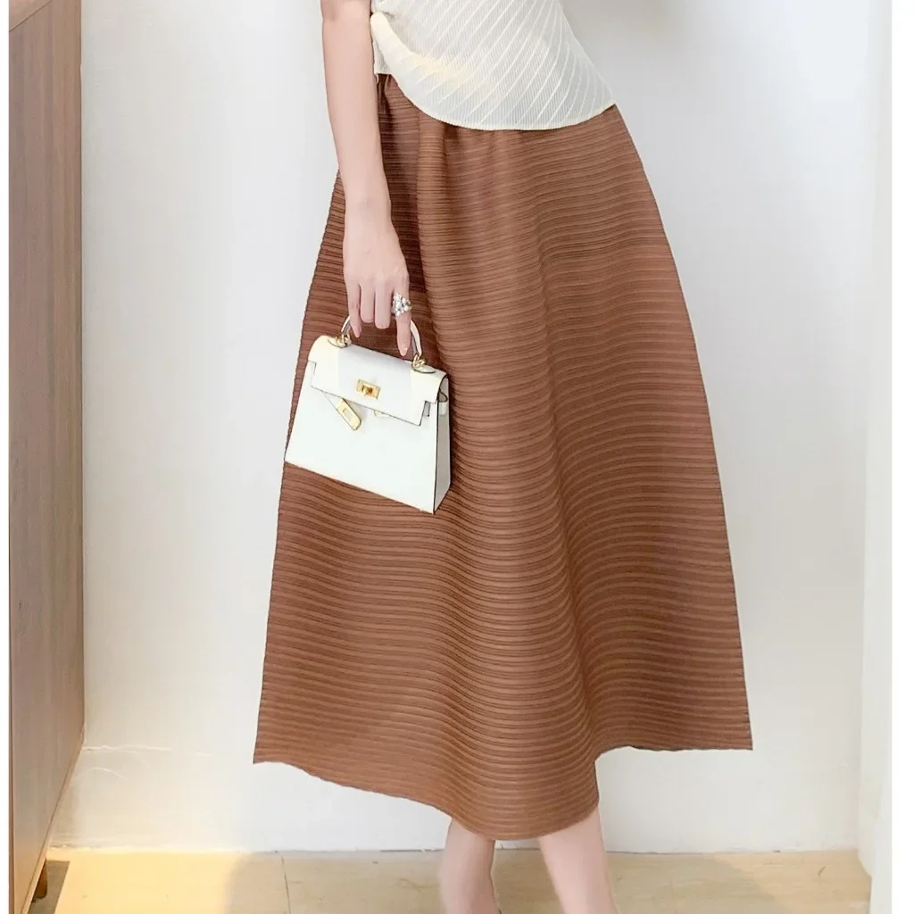 Doble Miyake plisada media falda de mujer 2025 primavera nuevo Horizontal minimalista Color sólido falda de diseño suelto 2025 novedad de verano