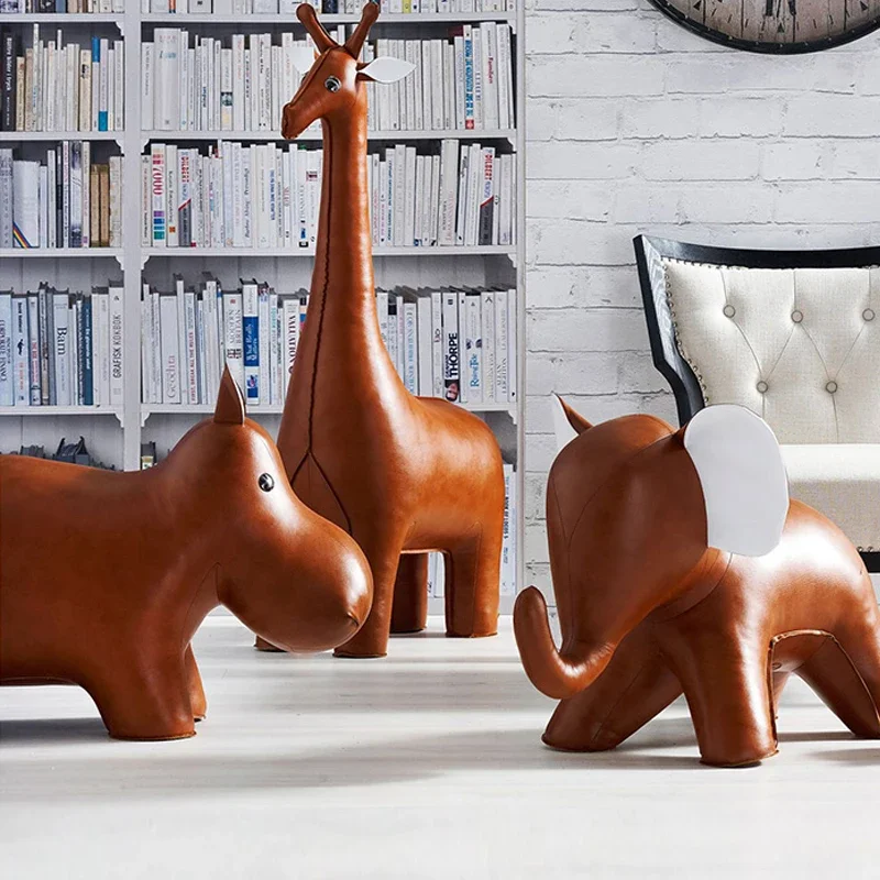 Oversized animal home decor accessories, leather elephant stools, chimpanzees, giraffes, hippopotamus