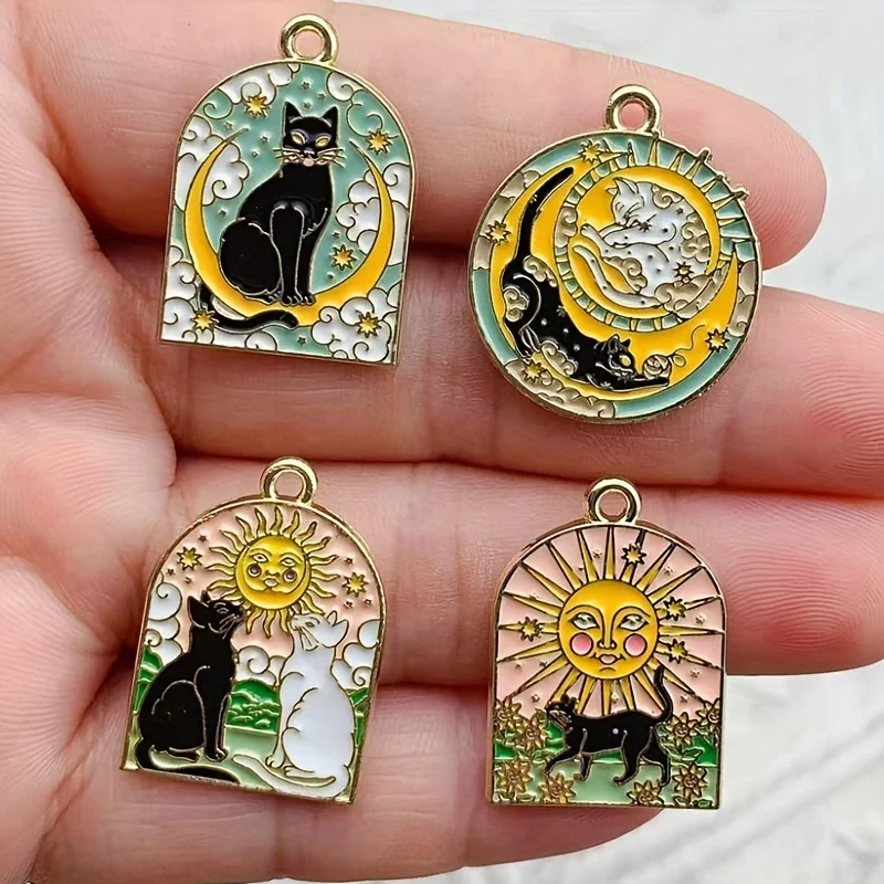 

Eight gilded sun, moon, and cat charms for DIY necklace, earring, and pendant making; enamel jewelry with ceiling patterns.