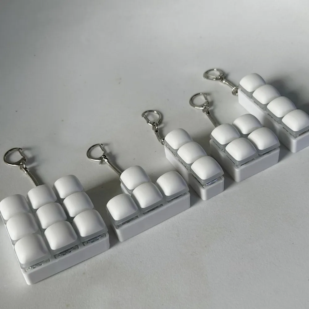 Relaxante 3/4/9 teclas Fidget llavero DIY teclado teclas botón Clicker juguete pan al vapor alivio estrés pellizco juguete adulto