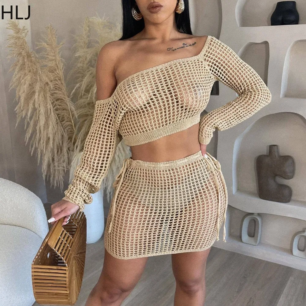 

HLJ Summer New Knitting Hollow Out Bandage Mini Skirts Two Piece Sets Women Off Shoulder Long Sleeve Crop Top And Skirts Outfits