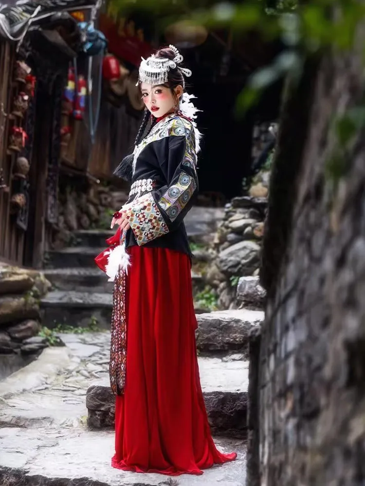 

A full set of red long-sleeved shirts with long ribbon skirt inside ethnic-style photography