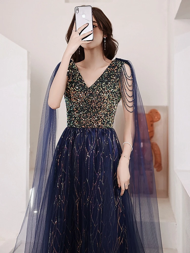 

Royal Blue Sparkly Celebrity Dresses V Neck Beading Sleeveless Luxury Tassel Cape Floor Length Formal Evening Party Host Gown