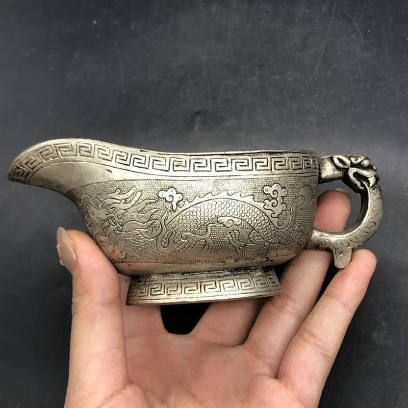 Antiqued gilded silver wine cup from the Tang Dynasty Zhen Guan era, featuring two dragons playing with a pearl, home decoration