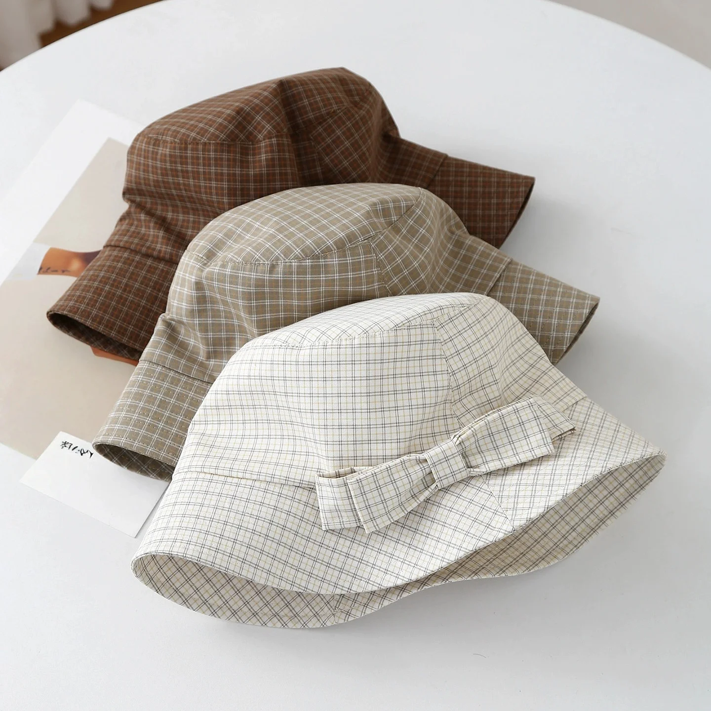 Checked Fisherman's Hat: A Versatile Sun Hat for Spring and Summer, Featuring A Bowl Shape and A Bow