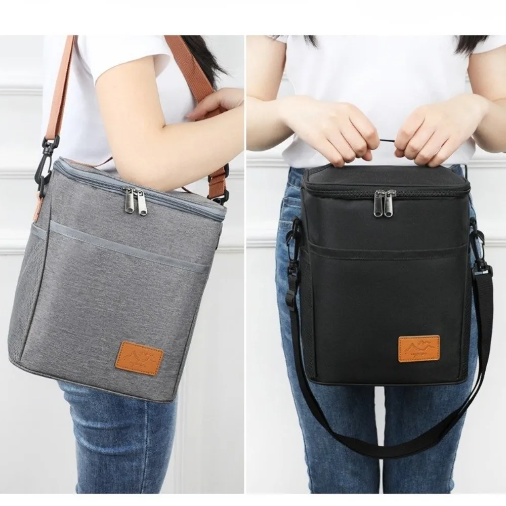 Lunch bag insulated with leakproof thermal lining, spacious interior, durable fabric, and stylish design for work, school, travel, and everyday meals.