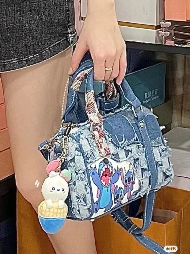 Stitch women\'s new fashion versatile personality creative cartoon pattern large capacity storage denim hole stitching handbag