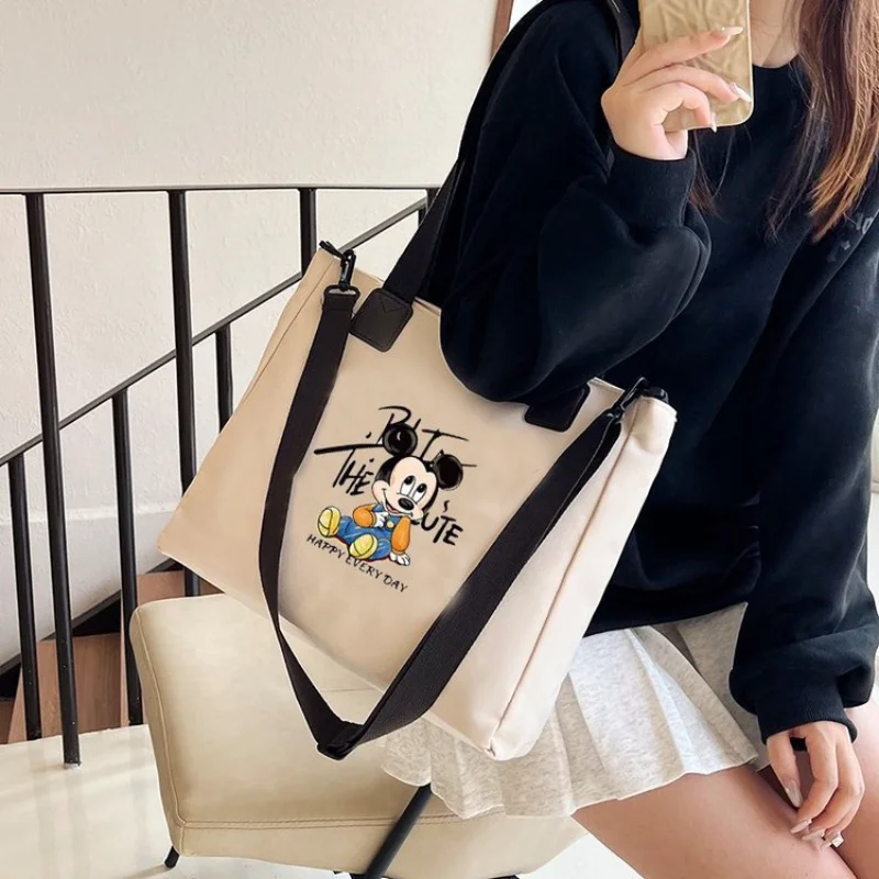 

Disney Mickey Mouse cartoon cute hand-held canvas bag Mickey simple fashion portable large capacity diagonal straddle backpack