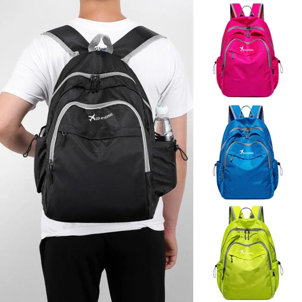 กระเป๋าเป้สะพายไหล่พับได้น้ำหนักเบากลางแจ้งความจุขนาดใหญ่เดินทางกระเป๋าเป้ถุงผ้าพกพานักเรียนสีทึบกระเป๋านักเรียน