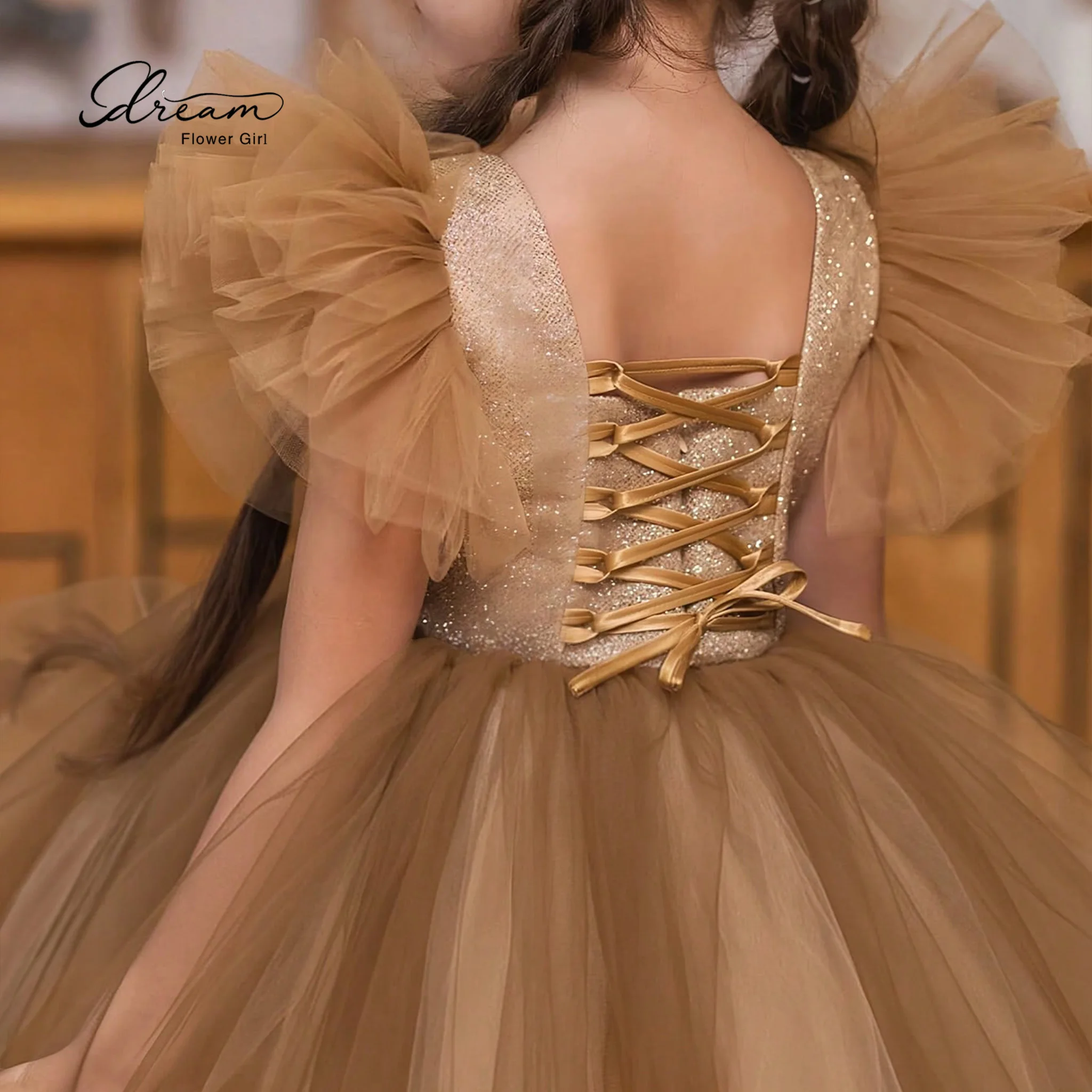 Champagne-colored formal party dress for girls featuring a round neck bell sleeves a voluminous skirt and a lace-up back