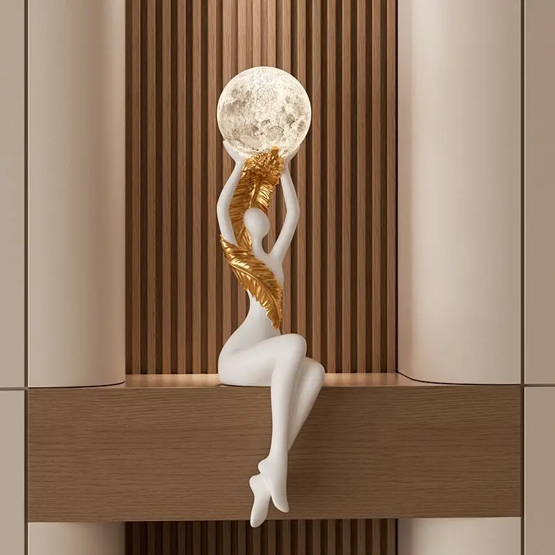 Light luxury hanging foot lamp, character sitting posture, high-end feeling, living room entrance, TV cabinet, housewarming gift