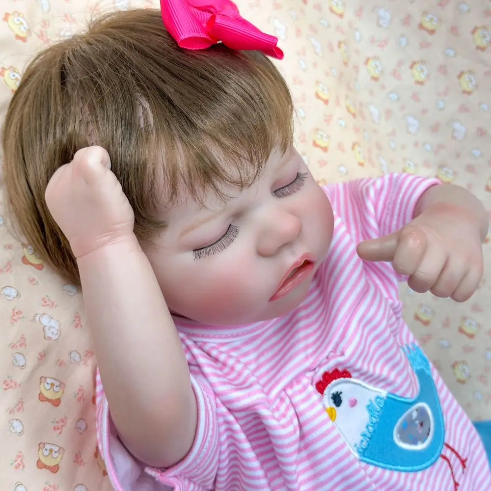 

18-inch Vinyl Reborn Girl Doll | Cute Closed-Eye Sleeping State | Pink Cartoon Outfit | Red Headdress | Poseable (Suck Finger)