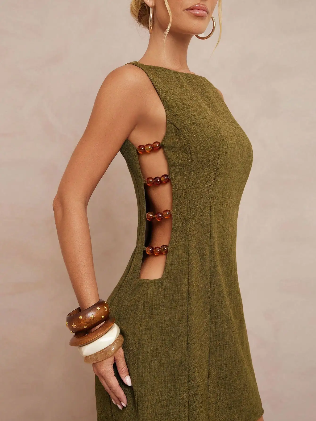 

Olive Green Sleeveless A-Line Mini Dress with Side Cut-Outs and Beaded Detail