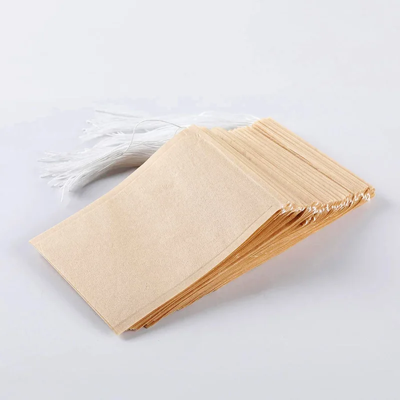 Sachets de thé en papier filtre biodégradable, sachet de thé de qualité alimentaire, écologique, avec cordon de serrage, poudre de feuille libre, passoire de phytothérapie, 100 pièces