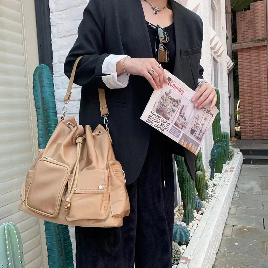 

Korean drawstring nylon bucket bag, casual and versatile single-shoulder bag, solid color commuter crossbody bag trendy backpack