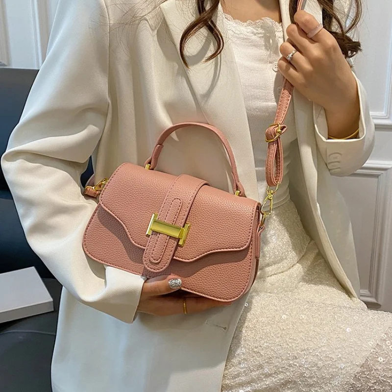 

Vintage Inspired Women Handbag With Carved Floral Design And Leather Fringe Details For Bohemian Style