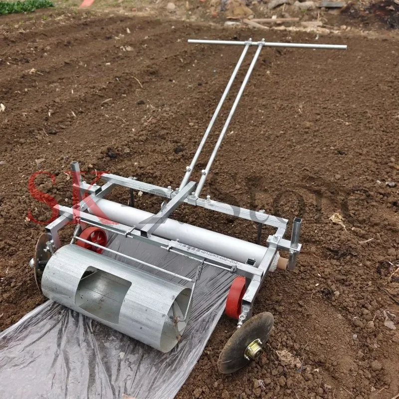 Manual miniature agricultural mulching machine, plastic film laying machine, roller-type mulching machine.