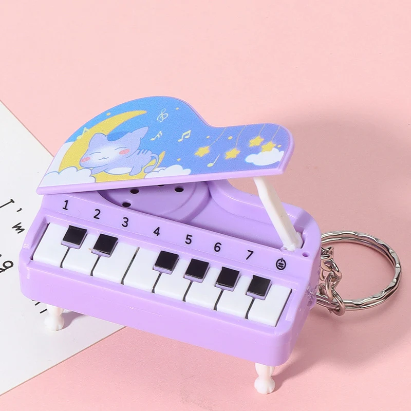 Criativo dos desenhos animados música piano eletrônico chaveiros engraçado brinquedos de som mini instrumento musical piano pingente chaveiro presente aniversário