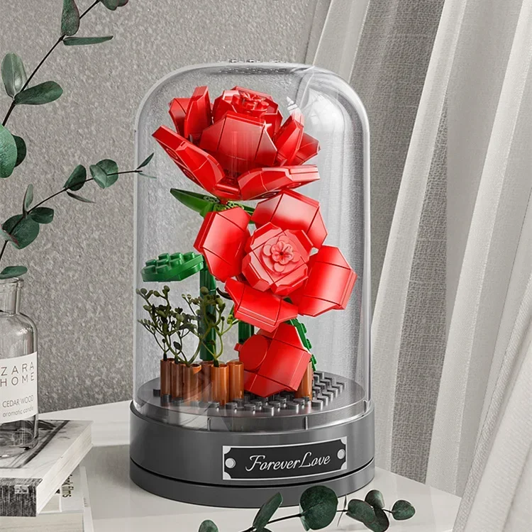 Building blocks music box Clockwork rotating music box Building blocks Rose Lily of the valley puzzle set Valentine\'s Day gift