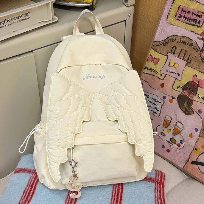 Mochila con alas estilo Y2k para mujer, bolso de lona con bonito Ángel japonés, bolso de hombro de gran capacidad con borlas creativas de Color sólido para estudiantes