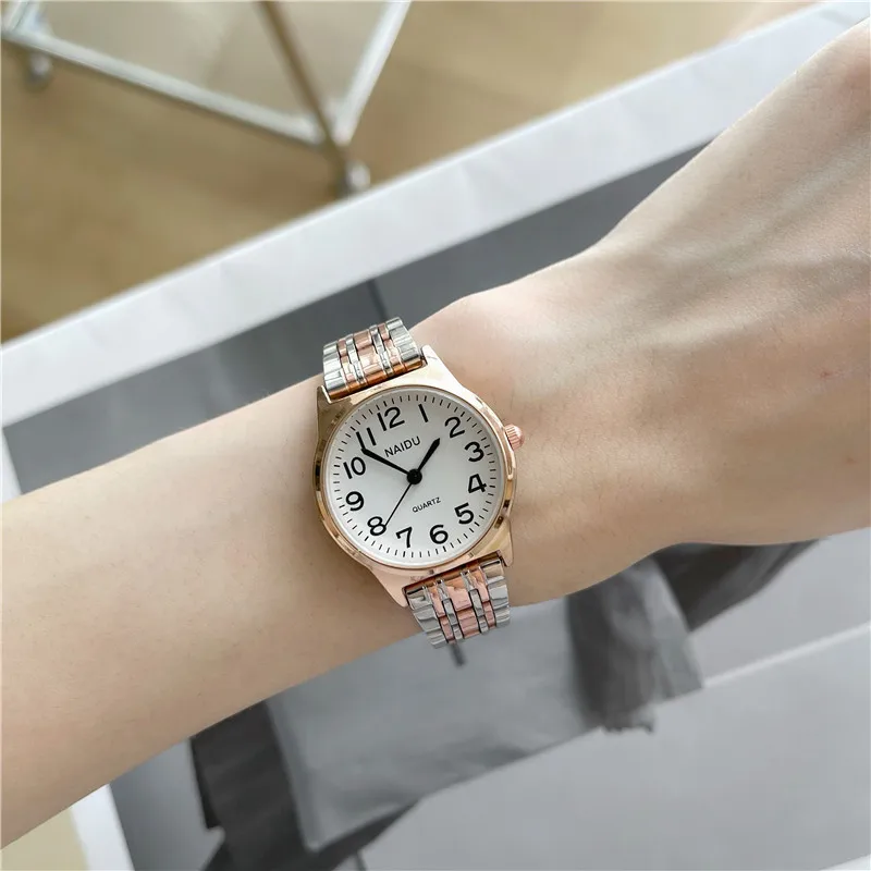 Reloj de cuarzo simple de alta calidad, reloj resistente al agua con correa de acero de temperamento de moda resistente al agua de lujo de nicho elegante para mujer
