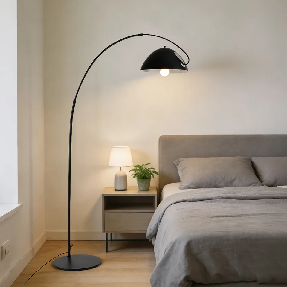 Black arched floor lamp, 72 inches (approx. 185 cm) tall, with an adjustable LED reading light; suitable for living rooms, bedrooms, offices, and more; features a modern curved metal design and a foot switch (bulb not included).