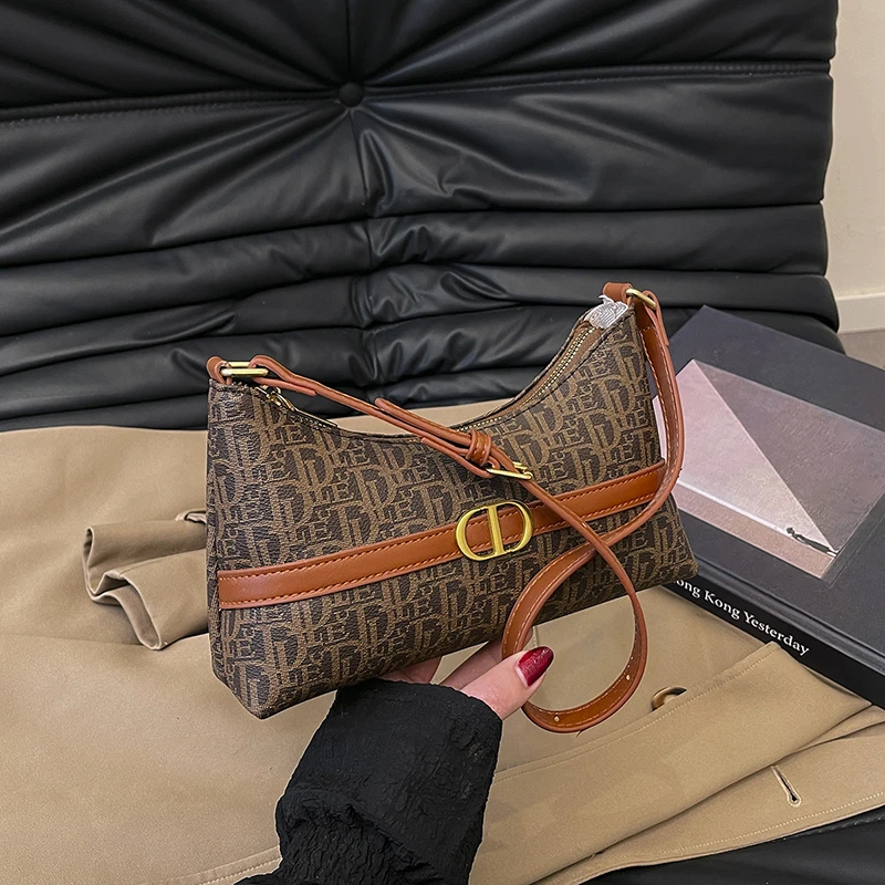 2025年新版 エレガントなトップハンドルバッグ チェーンディテール付き プレミアムスムースレザー デイトゥナイト 多用途 キャリーエッセンシャル