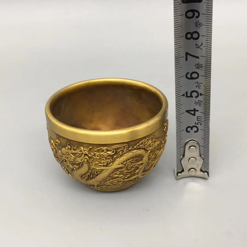 Antique-style copperware collection: a pair of brass dragon and phoenix small wine glasses, vintage home wine cabinet decorative