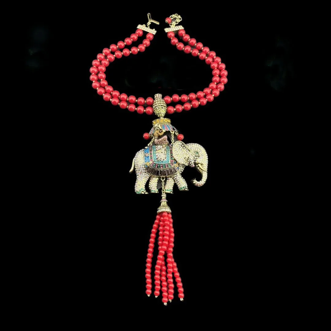 

Double Layered Red Crystal Necklace with Tassels Crystal CZ Paved elephant pendant