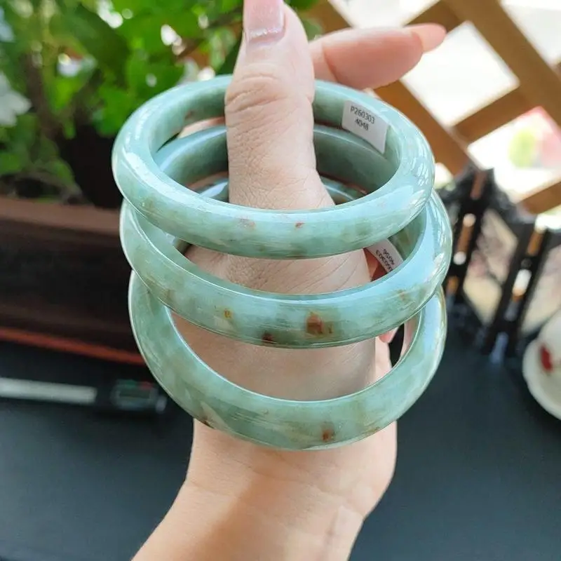 A bracelet, fine smooth texture, moist and translucent, light oil green with red highlights, grade A jadeite w