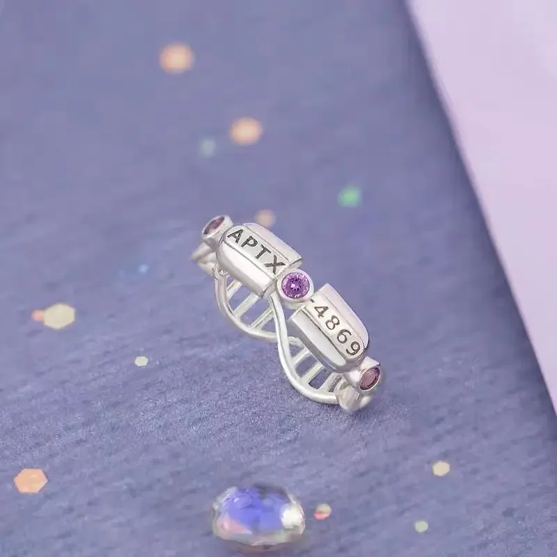 Detective Conan mismo estilo 4869 cápsula APTX tema nicho lindo anillo simple accesorios de anime regalos de vacaciones para hombres y mujeres