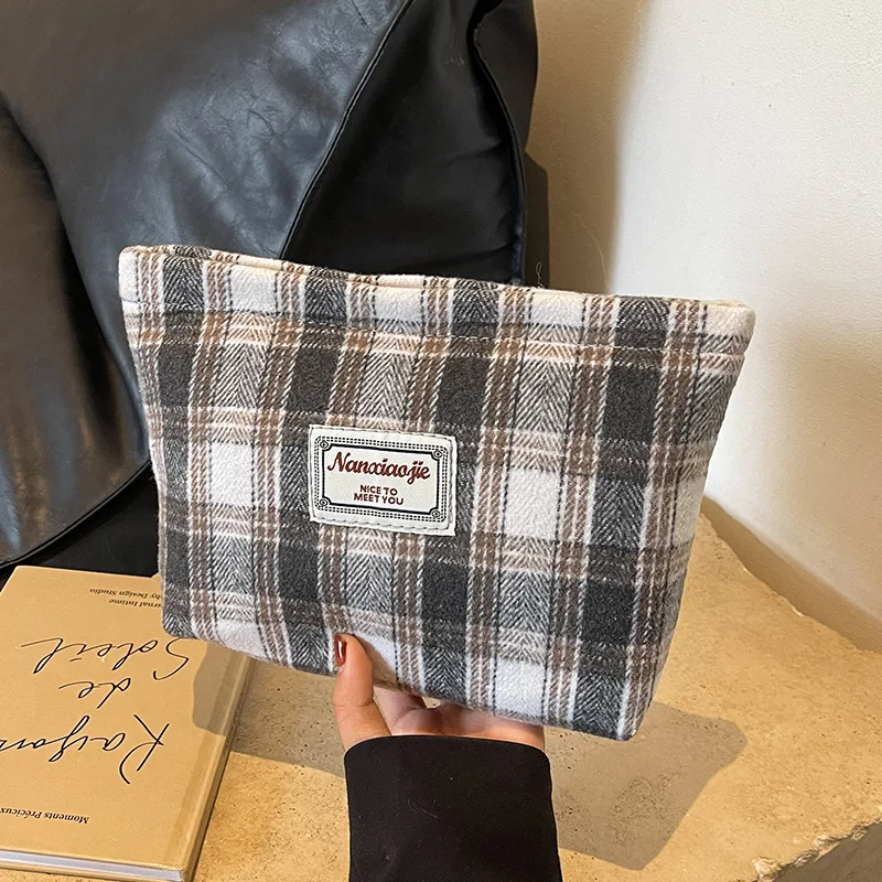 Striped woolen high appearance level hand makeup bag large capacity light and thin students travel to receive toiletry bag