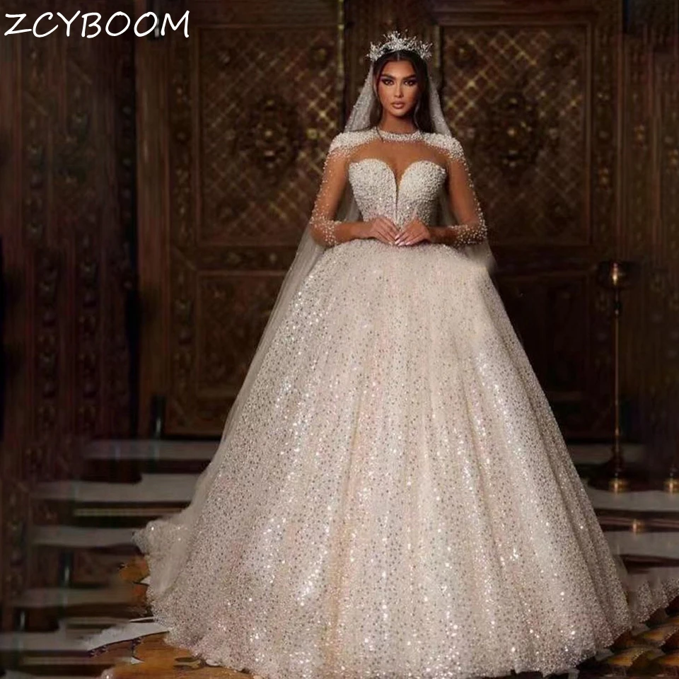 Customized Luxurious Sequin Shiny Beaded Crystal Wedding Dresses 2023 Illusion Long Sleeves O-Neck Court Train Tulle Bridal Gown