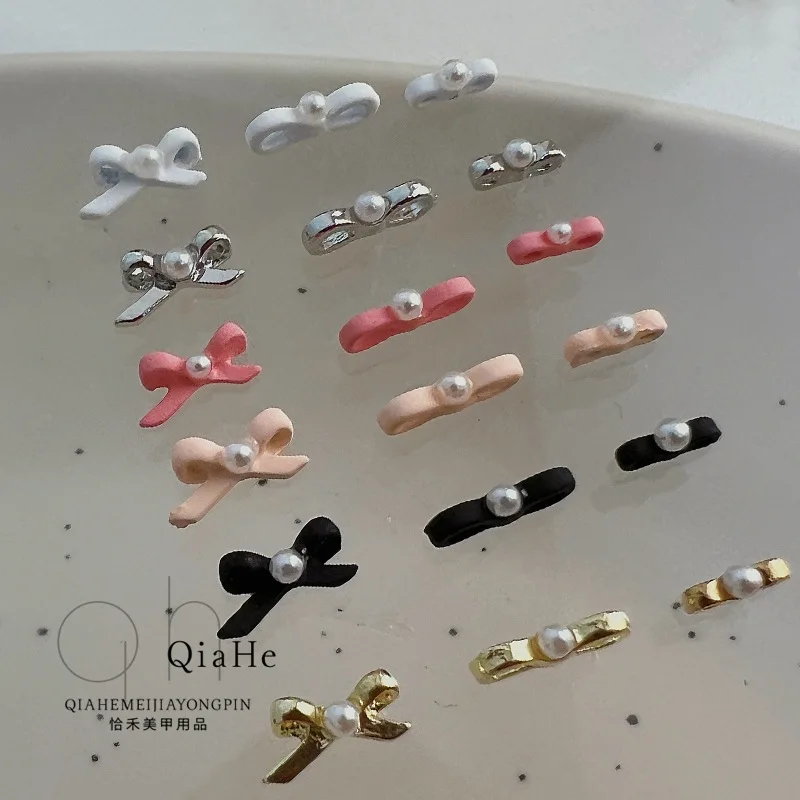 

10pcs/bag Ballet shoes Nail bows Pearl streamers bow tie Girly Girl Pure Wind Alloy spray paint stereoscopic nail accessories.