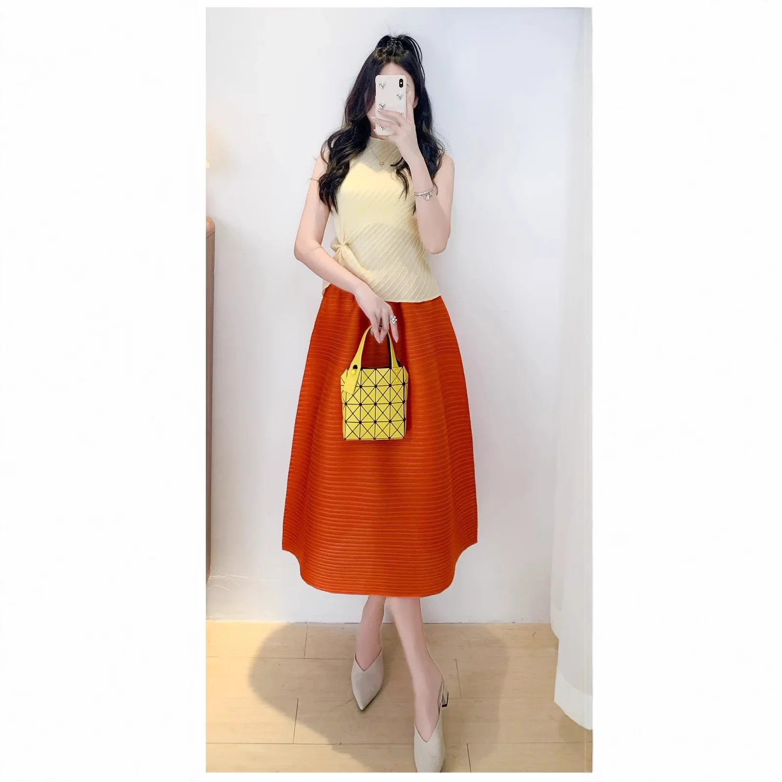 Doble Miyake plisada media falda de mujer 2025 primavera nuevo Horizontal minimalista Color sólido falda de diseño suelto 2025 novedad de verano