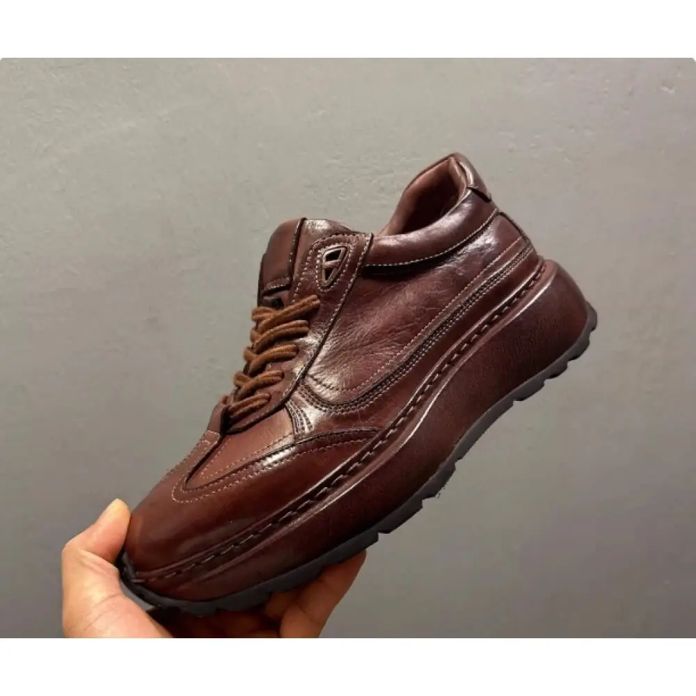 

Премиальные кожаные кроссовки на платформе темно-коричневого цвета – ручная работа, комфорт и вневременный стиль