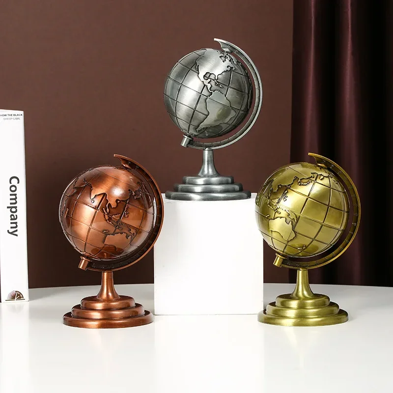 It is a handicraft zinc small retro 3D globe model antique ornament.