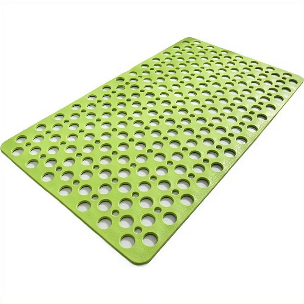 Blue bath mat with suction cups and drainage holes for slip-free shower.