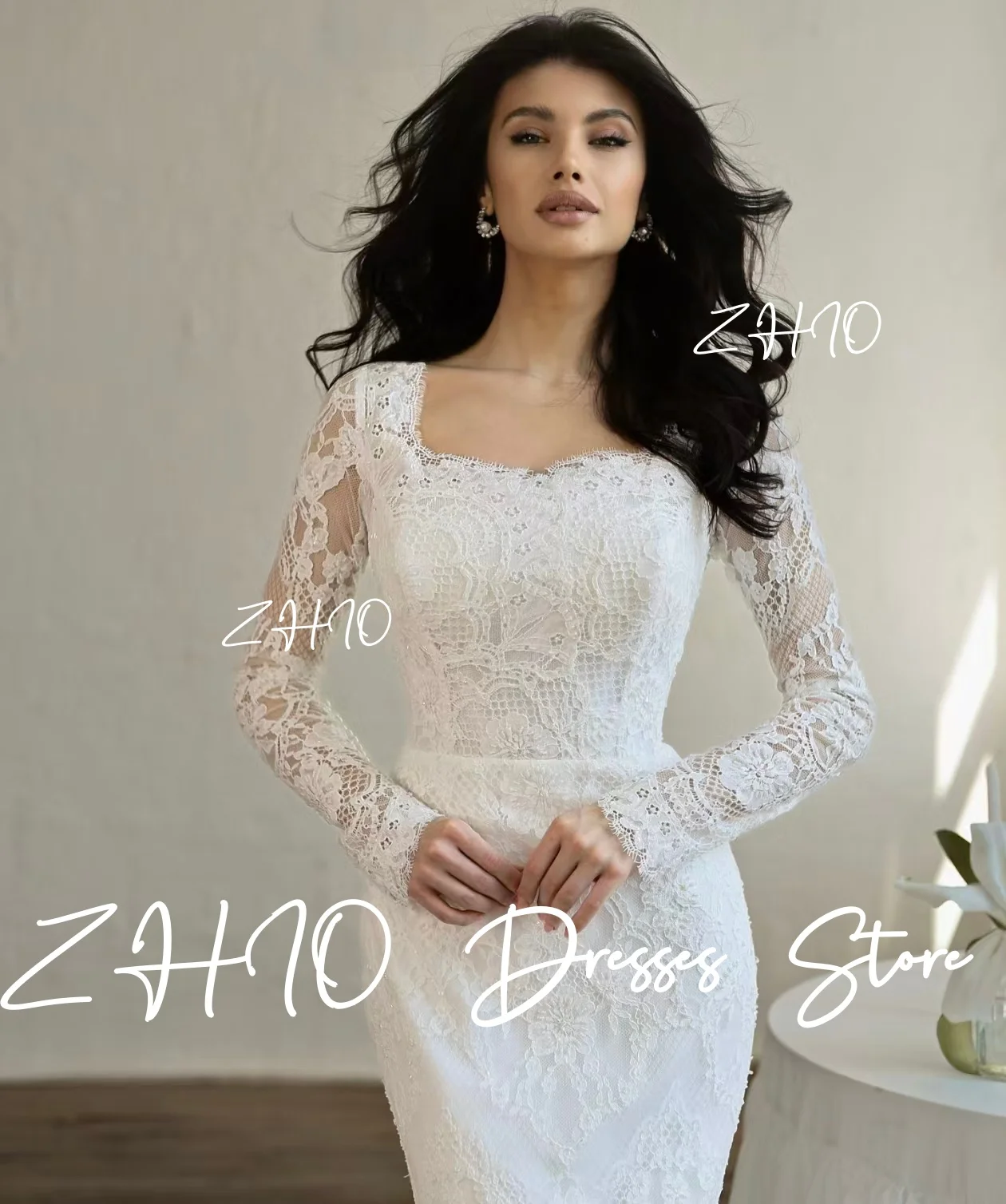 ชุดแต่งงานลูกไม้สีขาวหรูหรา แขนยาวทรงเมอร์เมด พร้อมชายกระโปรงยาวแบบสวีปเทรน  ชุดราตรีสั่งตัดได้  ชุดเจ้าสาว