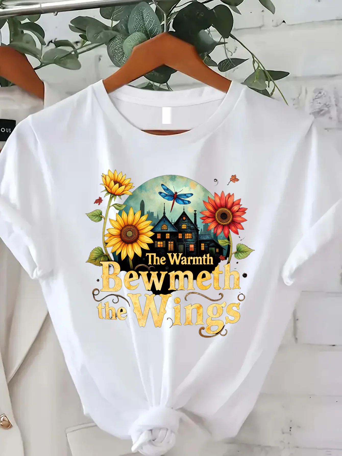 

Comfortable Women's Print T-shirt "Cozy Cottage Sunflower T-Shirt - 'The Warmth Bewmeth the Wings' Design"