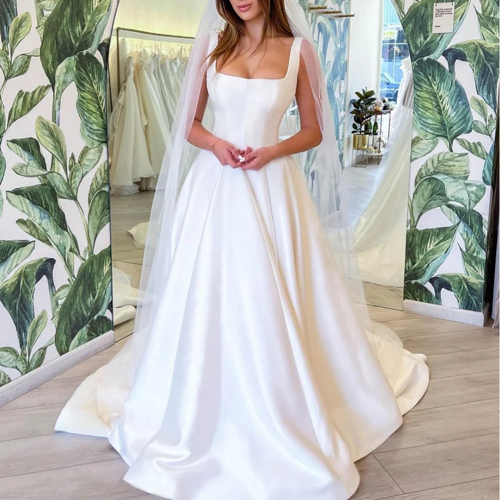 Abito da sposa moderno in raso bianco con colletto quadrato, abiti da sposa semplici per la sposa 2024 Abiti da sposa eleganti senza maniche a linea A