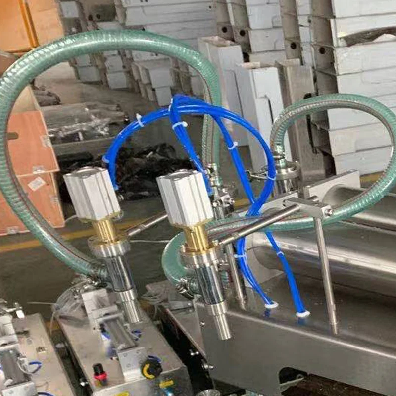 آلة تعبئة السوائل من نوع المكبس بفوهتين آلة تعبئة السوائل الكمية الهوائية