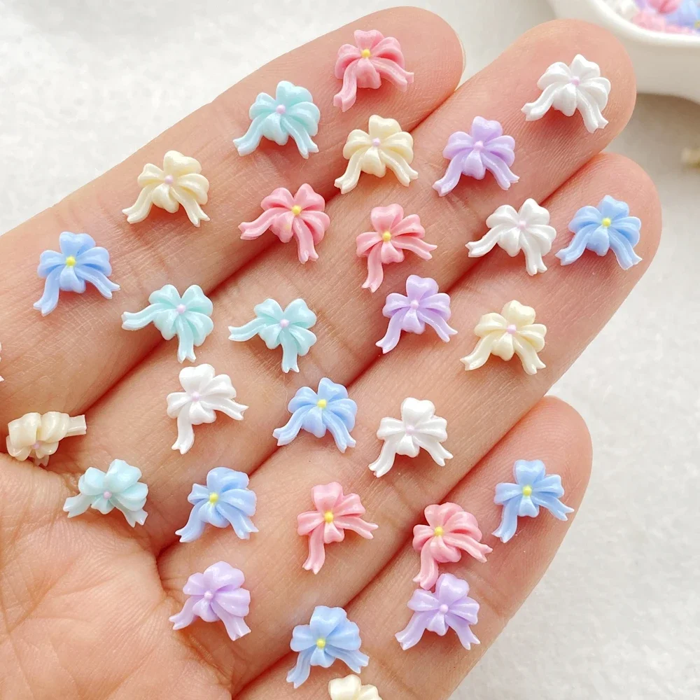 100 ชิ้นผสมสีสันโบว์ริบบิ้นเล็บแบน Rhinestone ลูกปัดสมุดภาพ DIY เล็บ Appliques อุปกรณ์เสริมหัตถกรรม