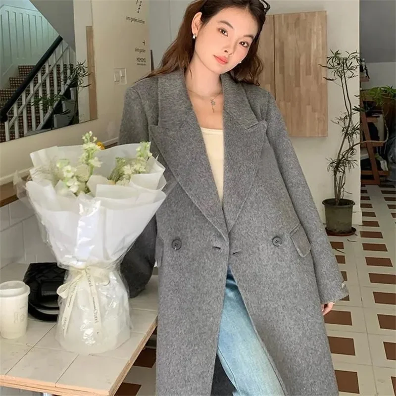 2026 Cappotto di lana con petto abbassato da donna autunno 2026 Moda stile sciolto Abbigliamento invernale da donna Cappotti lunghi Top